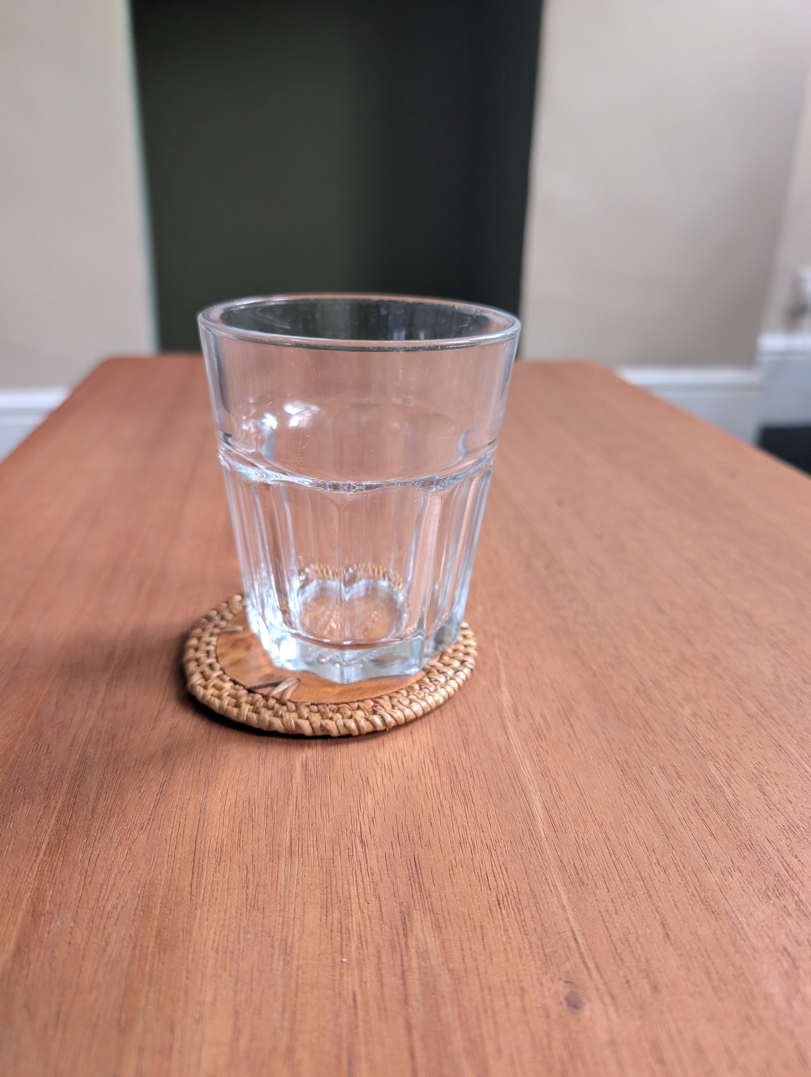 An empty glass on a wooden table